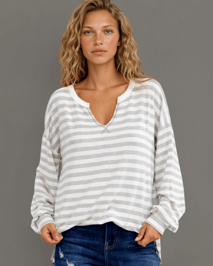 Made in USA. Grey &amp; white striped lightweight oversized pullover. Split V-neck, dropped shoulder, side slits. 68% rayon. Sizes S–XL.