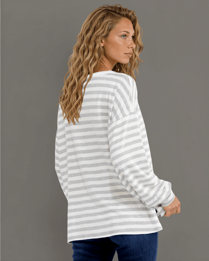 Made in USA. Grey &amp; white striped lightweight oversized pullover. Split V-neck, dropped shoulder, side slits. 68% rayon. Sizes S–XL.
