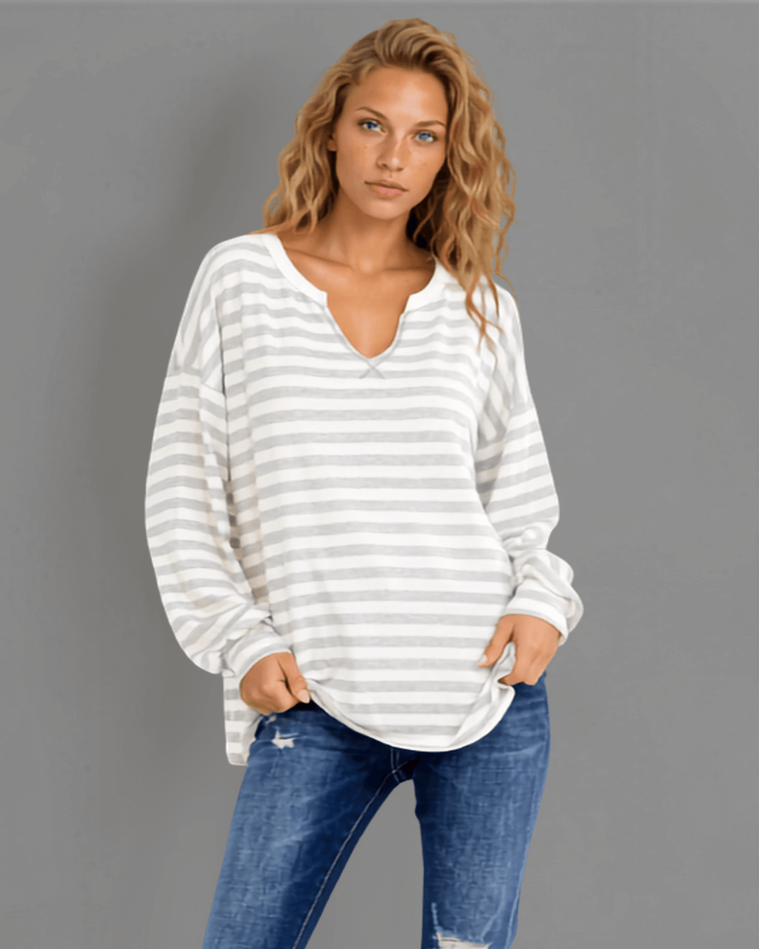 Made in USA. Grey &amp; white striped lightweight oversized pullover. Split V-neck, dropped shoulder, side slits. 68% rayon. Sizes S–XL.