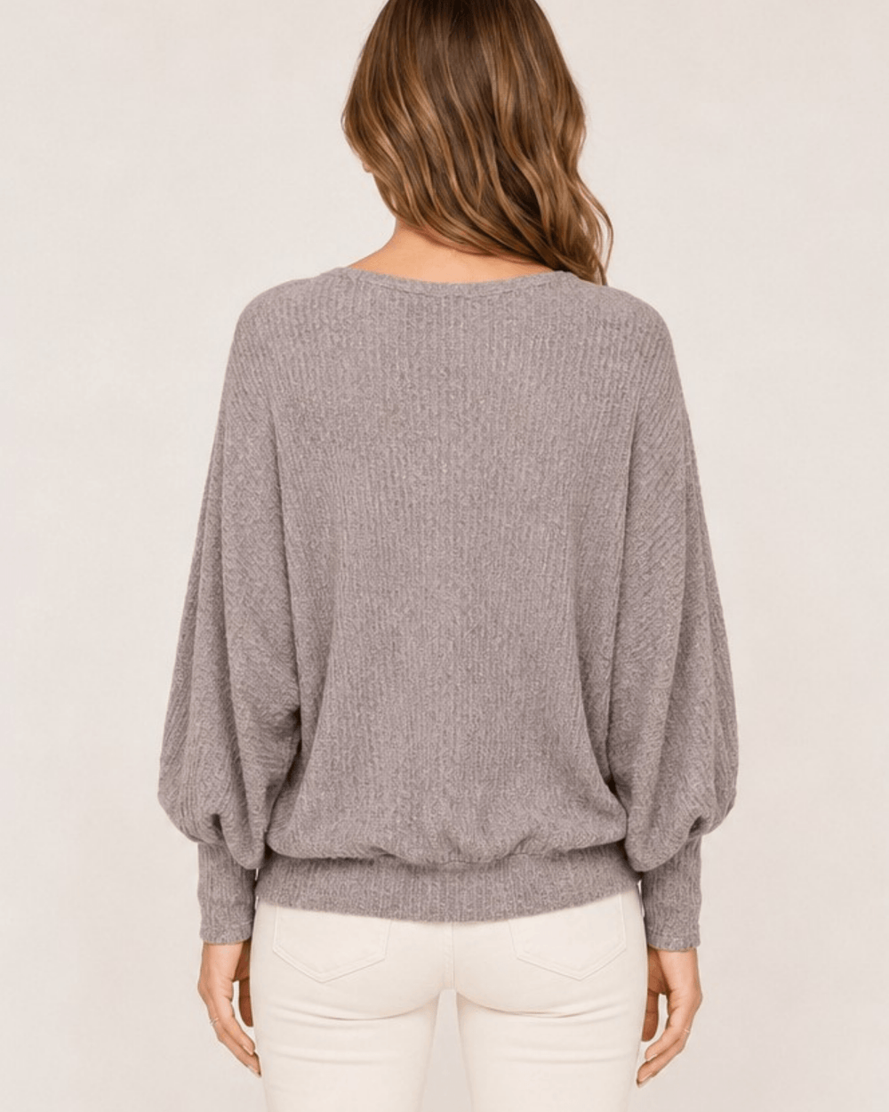 Made in USA. Women's light gray ribbed dolman top with balloon sleeves, a V-neck, and a relaxed fit in soft, lightweight knit.