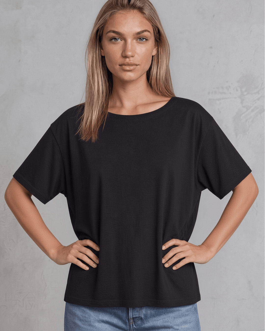 Made in USA, women's weekend boxy tee has a loose, flowy fit and wide neckline. Shop Black or White in sizes XS–2XL; 50% Lenzing Modal, 50% Polyester.