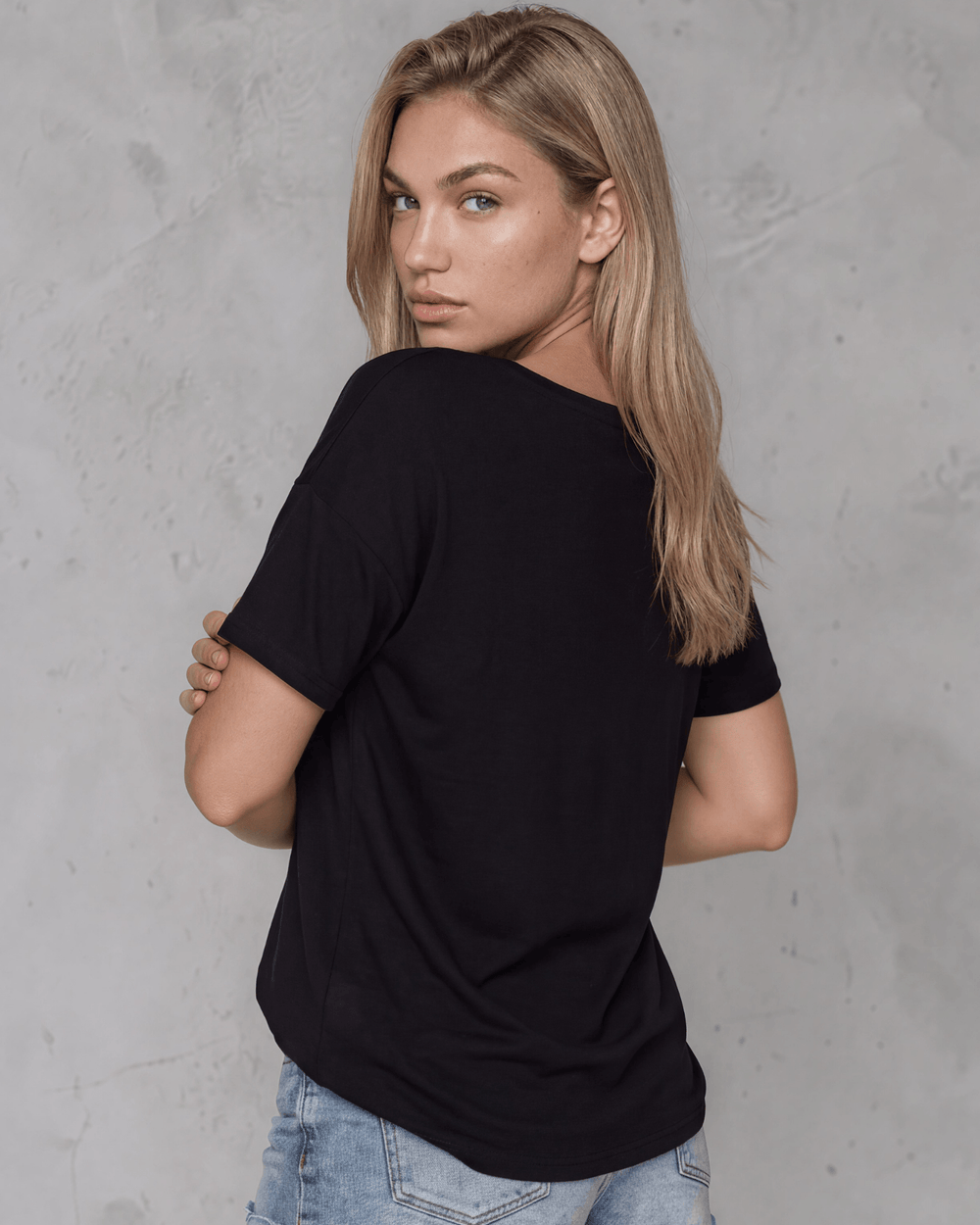 Made in USA, women's weekend boxy tee has a loose, flowy fit and wide neckline. Shop Black or White in sizes XS–2XL; 50% Lenzing Modal, 50% Polyester.