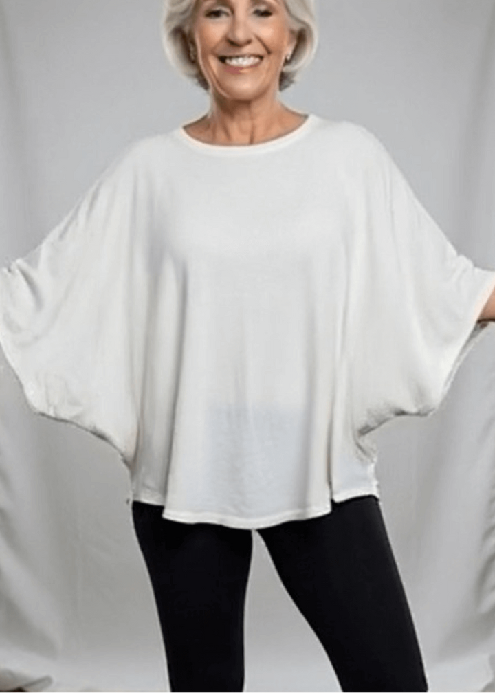 Slip into effortless style with this made in USA oversized dolman sleeve cotton top, designed for maximum comfort without compromise. The soft, lightweight 95% cotton blend with 5% spandex drapes beautifully while moving with you