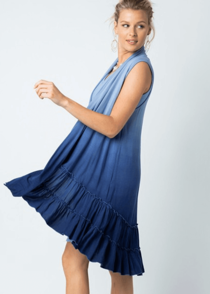 Blue ombre tie-dye meets effortless elegance in this versatile cardigan vest. Featuring a tiered ruffled hem and flowing silhouette, it transitions seamlessly from casual to dressed-up occasions. Crafted from a luxurious viscose-spandex blend for comfort and movement, this Made in USA piece is designed to flatter and inspire. 