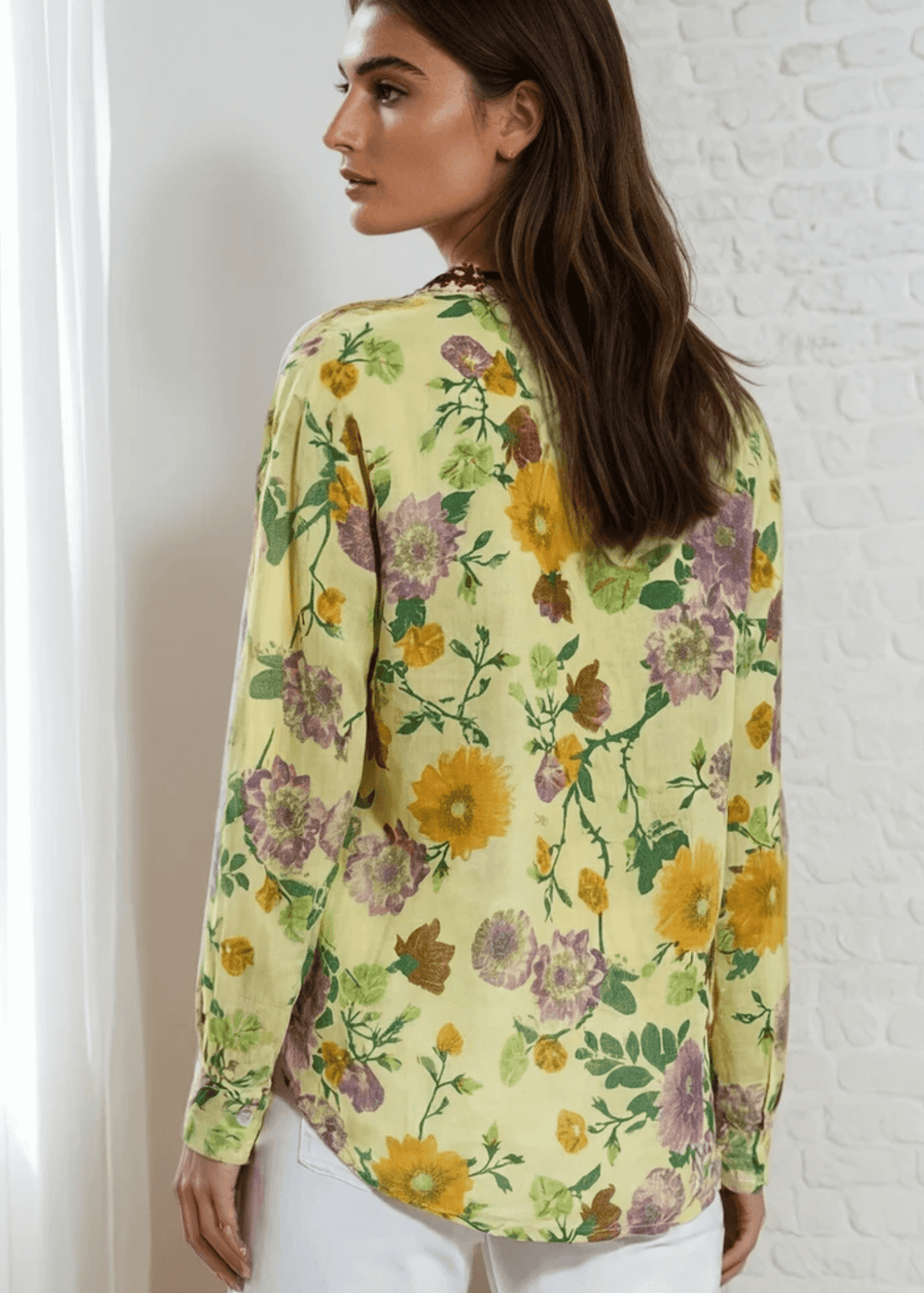 Bask in the beauty of effortless bohemian charm with the Carla Top. Crafted from soft, breathable cotton voile, this piece features a vibrant floral print in sun-kissed tones of golden marigold, lilac, and fresh green. The hand-embroidered deep red bib adds an artisanal touch, making each blouse unique. Designed with a relaxed silhouette and a flattering V-neckline, it's perfect for warm days or layered looks. Made in Los Angeles and finished with a light garment-dye wash for a soft, lived-in feel. 