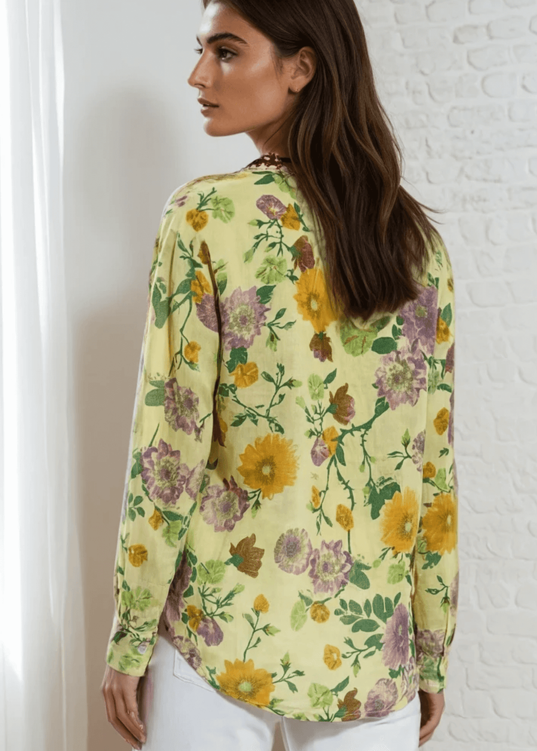 Bask in the beauty of effortless bohemian charm with the Carla Top. Crafted from soft, breathable cotton voile, this piece features a vibrant floral print in sun-kissed tones of golden marigold, lilac, and fresh green. The hand-embroidered deep red bib adds an artisanal touch, making each blouse unique. Designed with a relaxed silhouette and a flattering V-neckline, it's perfect for warm days or layered looks. Made in Los Angeles and finished with a light garment-dye wash for a soft, lived-in feel. 