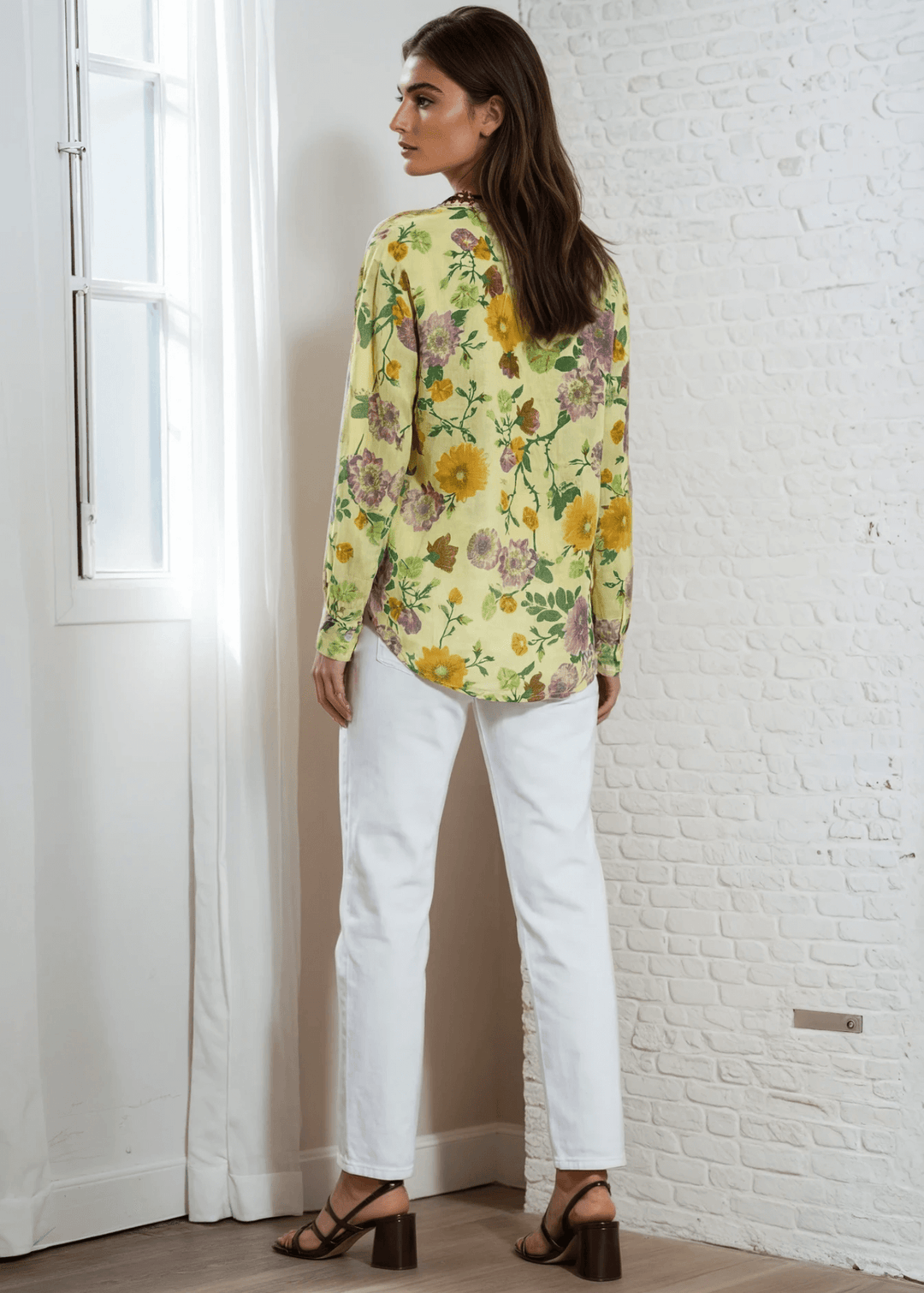 Bask in the beauty of effortless bohemian charm with the Carla Top. Crafted from soft, breathable cotton voile, this piece features a vibrant floral print in sun-kissed tones of golden marigold, lilac, and fresh green. The hand-embroidered deep red bib adds an artisanal touch, making each blouse unique. Designed with a relaxed silhouette and a flattering V-neckline, it's perfect for warm days or layered looks. Made in Los Angeles and finished with a light garment-dye wash for a soft, lived-in feel. 