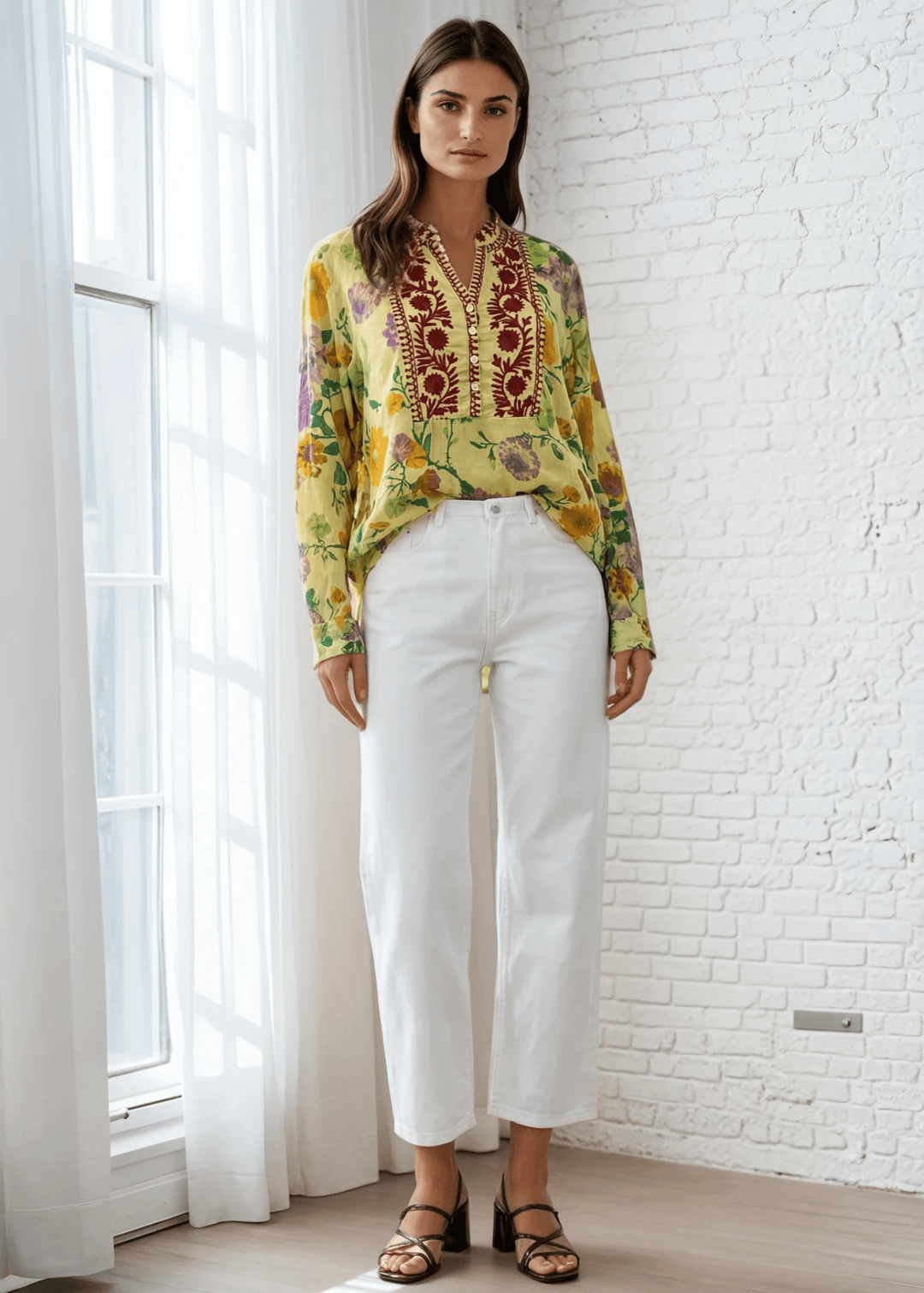 Bask in the beauty of effortless bohemian charm with the Carla Top. Crafted from soft, breathable cotton voile, this piece features a vibrant floral print in sun-kissed tones of golden marigold, lilac, and fresh green. The hand-embroidered deep red bib adds an artisanal touch, making each blouse unique. Designed with a relaxed silhouette and a flattering V-neckline, it's perfect for warm days or layered looks. Made in Los Angeles and finished with a light garment-dye wash for a soft, lived-in feel. 