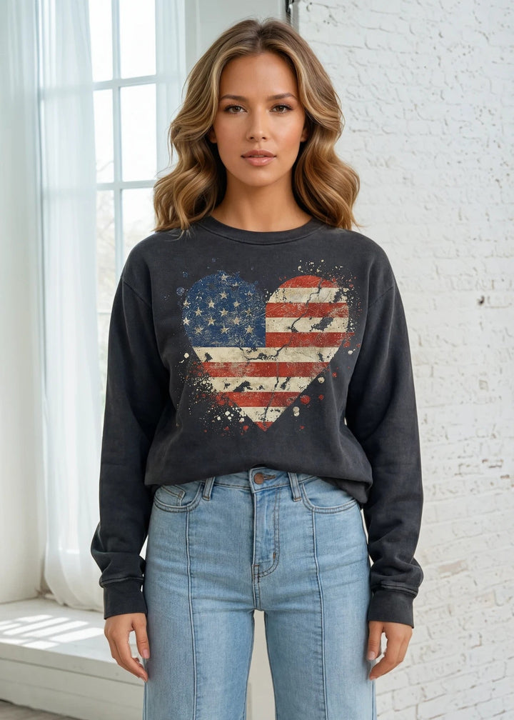 Celebrate American pride with this heavyweight sweatshirt, featuring a distressed flag heart graphic on pigment-dyed cotton fleece. The relaxed crew neck silhouette and long sleeves deliver comfort through fall and winter months. Crafted from 100% preshrunk cotton and made in the USA, this piece resists fading and maintains its shape wash after wash. 