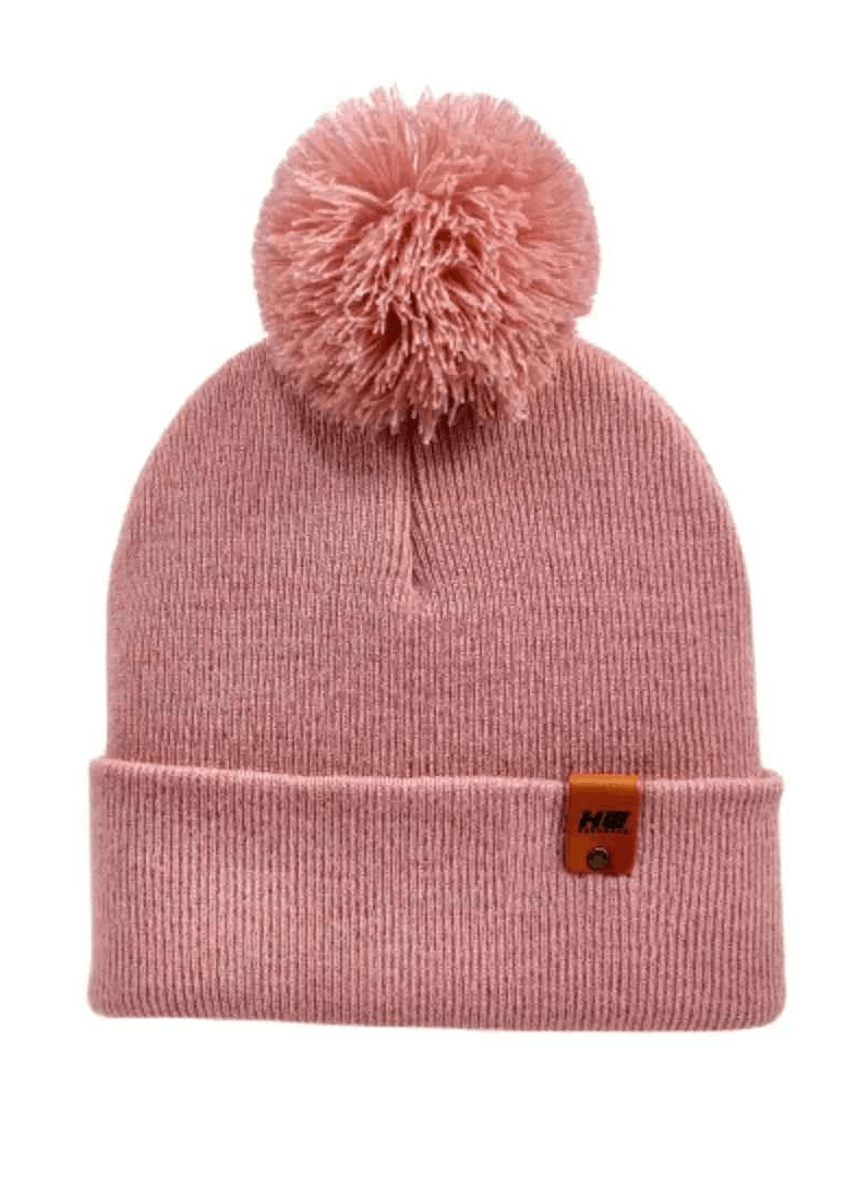 Keep warm and stylish with the HAAKWEAR PomPom Beanie in Pearl Pink, proudly made in the USA. This cozy beanie is perfect for adding a touch of fashion to your winter wardrobe. . Made from 100% Acrylic.
