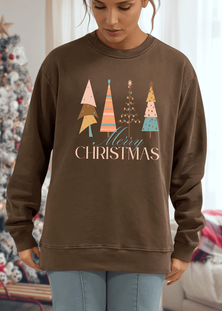 Celebrate the season in comfort with this heavyweight pigment-dyed cotton sweatshirt, featuring a charming pastel Christmas tree graphic. Crafted with excellent USA quality that lasts, this piece offers a relaxed, loose-fitting silhouette perfect for cozy gatherings and casual days. The crew neck and long sleeves provide warmth, while the durable construction ensures it becomes a holiday favorite year after year. Choose from Washed Black, Evergreen, or Mocha