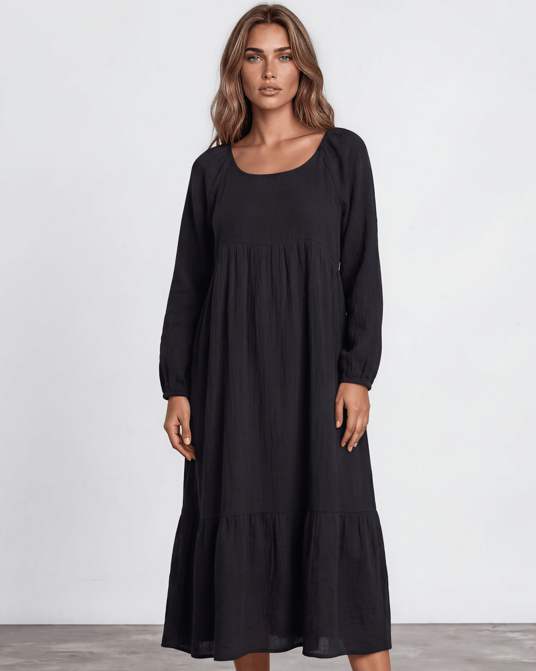 Black Cotton Gauze Maxi Dress. Scoop neck,  empire waist, long billowy sleeves, tiered ruffle hem, 100% cotton. S–XL. Made in USA.