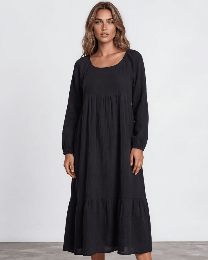 Black Cotton Gauze Maxi Dress. Scoop neck,  empire waist, long billowy sleeves, tiered ruffle hem, 100% cotton. S–XL. Made in USA.