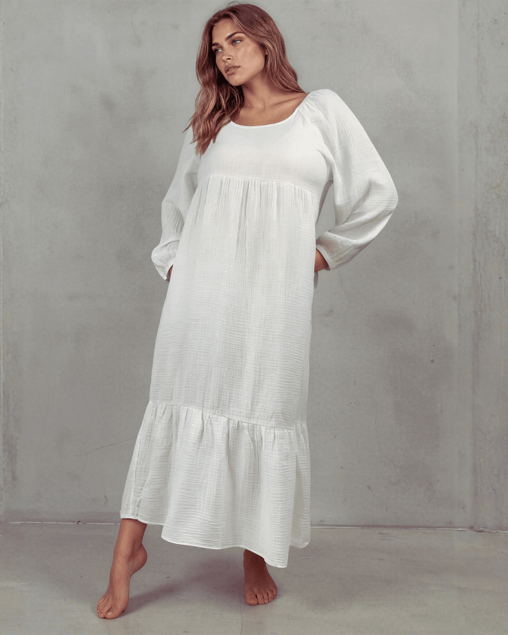  White Cotton Gauze Maxi Dress. Scoop neck, billowy sleeves, tiered ruffle hem, 100% cotton. S–XL. Made in USA.