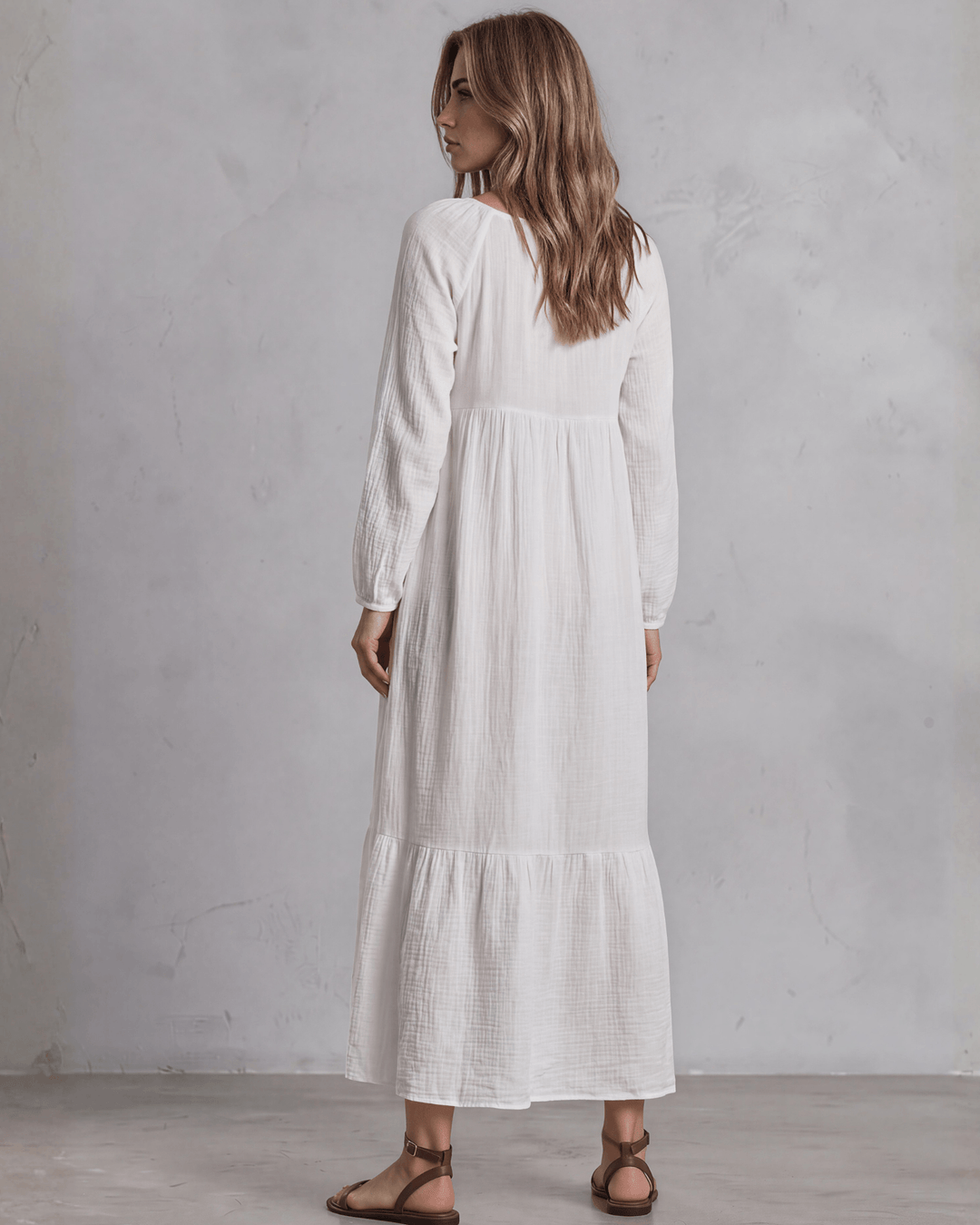  White Cotton Gauze Maxi Dress. Scoop neck, billowy sleeves, tiered ruffle hem, 100% cotton. S–XL. Made in USA.