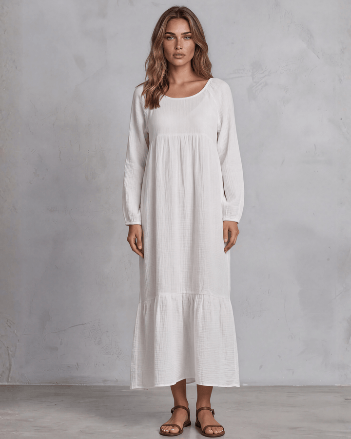  White Cotton Gauze Maxi Dress. Scoop neck, billowy sleeves, tiered ruffle hem, 100% cotton. S–XL. Made in USA.