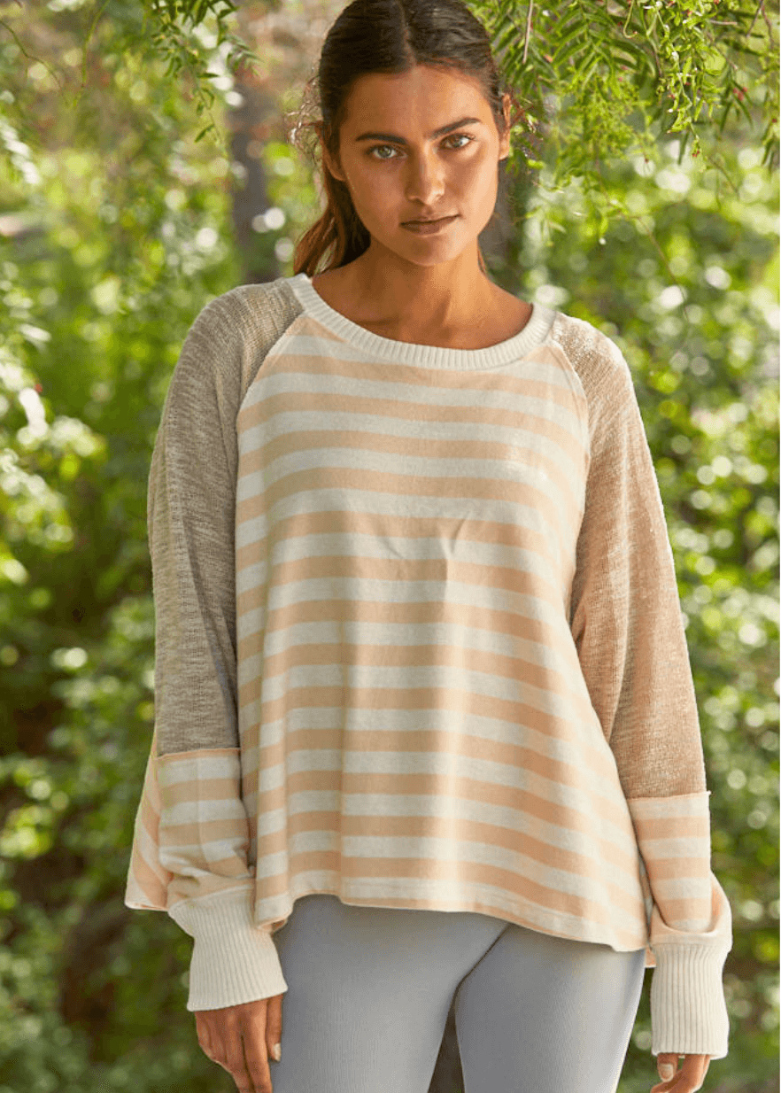 Made in USA for effortless style and comfort, The mixed media contrast with striped detail women's long sleeve top adds a modern edge, making it perfect for both casual days and stylish outings.  Colors in this top: Pale Peach, Cream and Taupe
