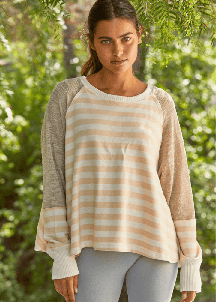 Made in USA for effortless style and comfort, The mixed media contrast with striped detail women's long sleeve top adds a modern edge, making it perfect for both casual days and stylish outings.  Colors in this top: Pale Peach, Cream and Taupe