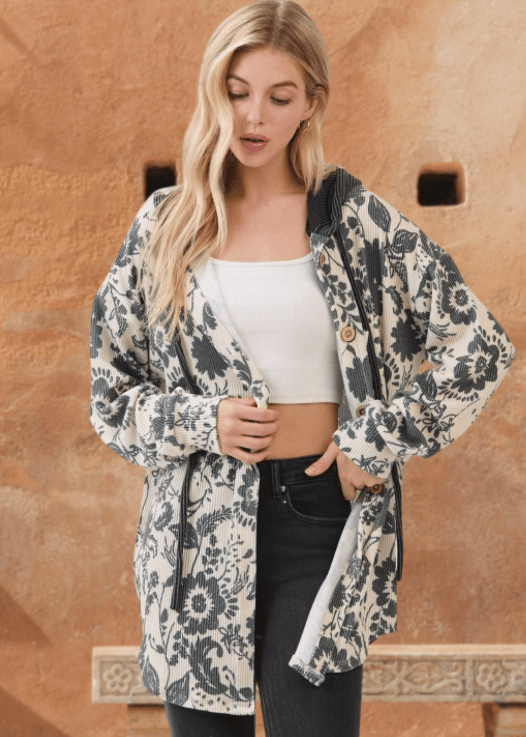 Elevate your layering game with the Elise Floral Ribbed Knit Shacket—a versatile piece that seamlessly transitions from season to season. Crafted from a soft ribbed knit in a striking allover floral pattern, this shacket combines comfort with contemporary style. 