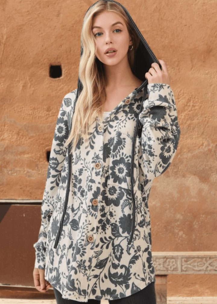 Elevate your layering game with the Elise Floral Ribbed Knit Shacket—a versatile piece that seamlessly transitions from season to season. Crafted from a soft ribbed knit in a striking allover floral pattern, this shacket combines comfort with contemporary style. 