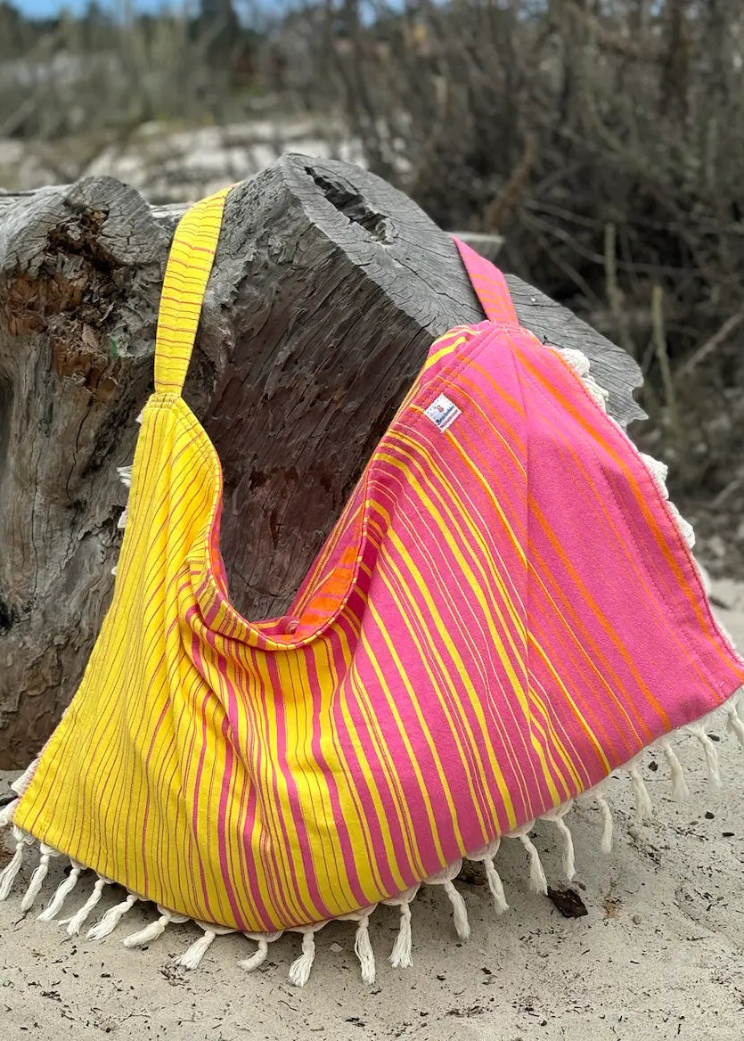 Shop the Beachables Striped 3-in-1 Turkish Cotton Beach Bag – converts from bag to towel to chair cover. Sand-resistant, quick-dry, machine washable. Made in USA.