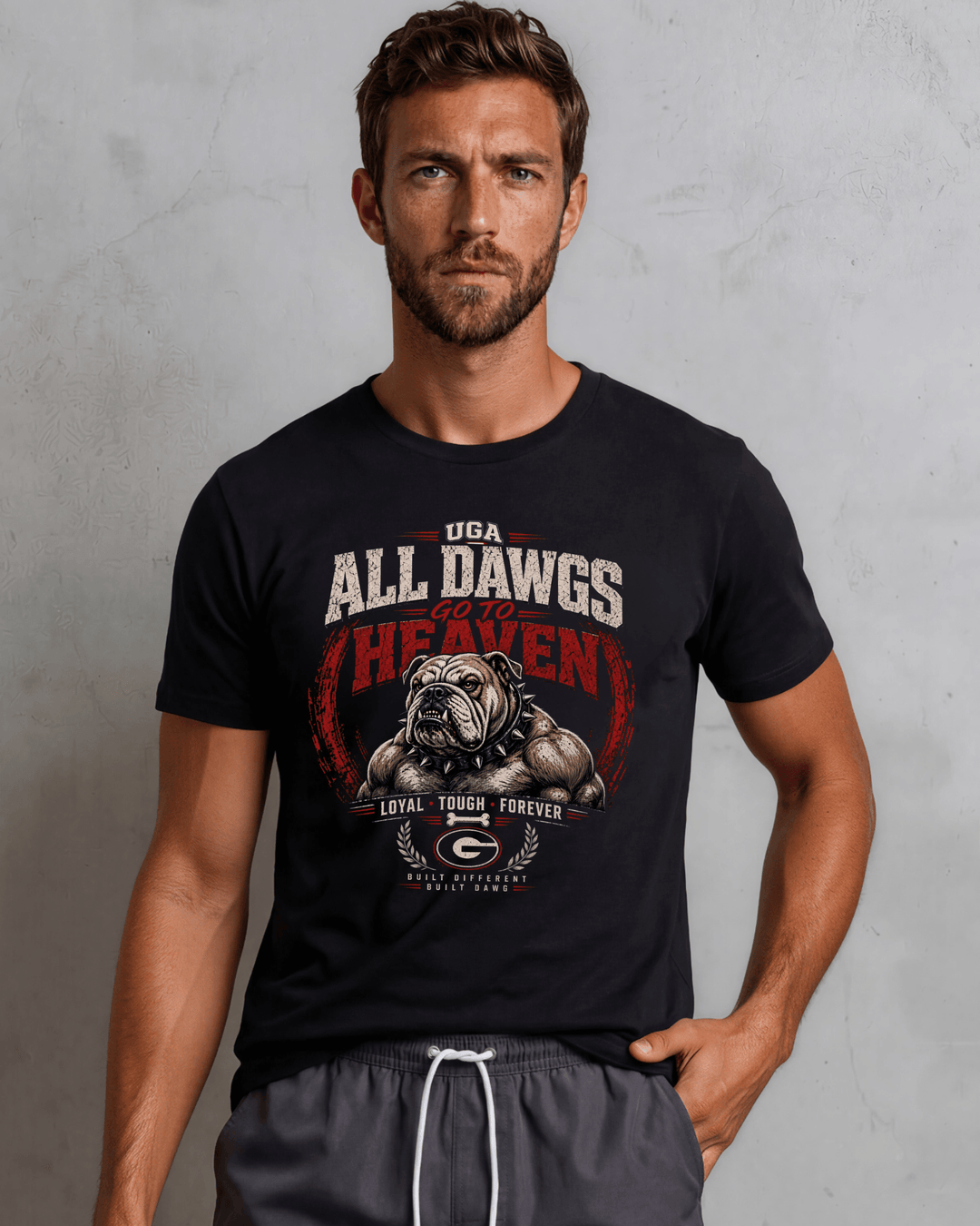 UGA Bulldogs All Dawgs Go To Heaven graphic tee, made in USA with 100% USA-grown cotton. Black crew neck, semi-fitted. Sizes S–3XL.