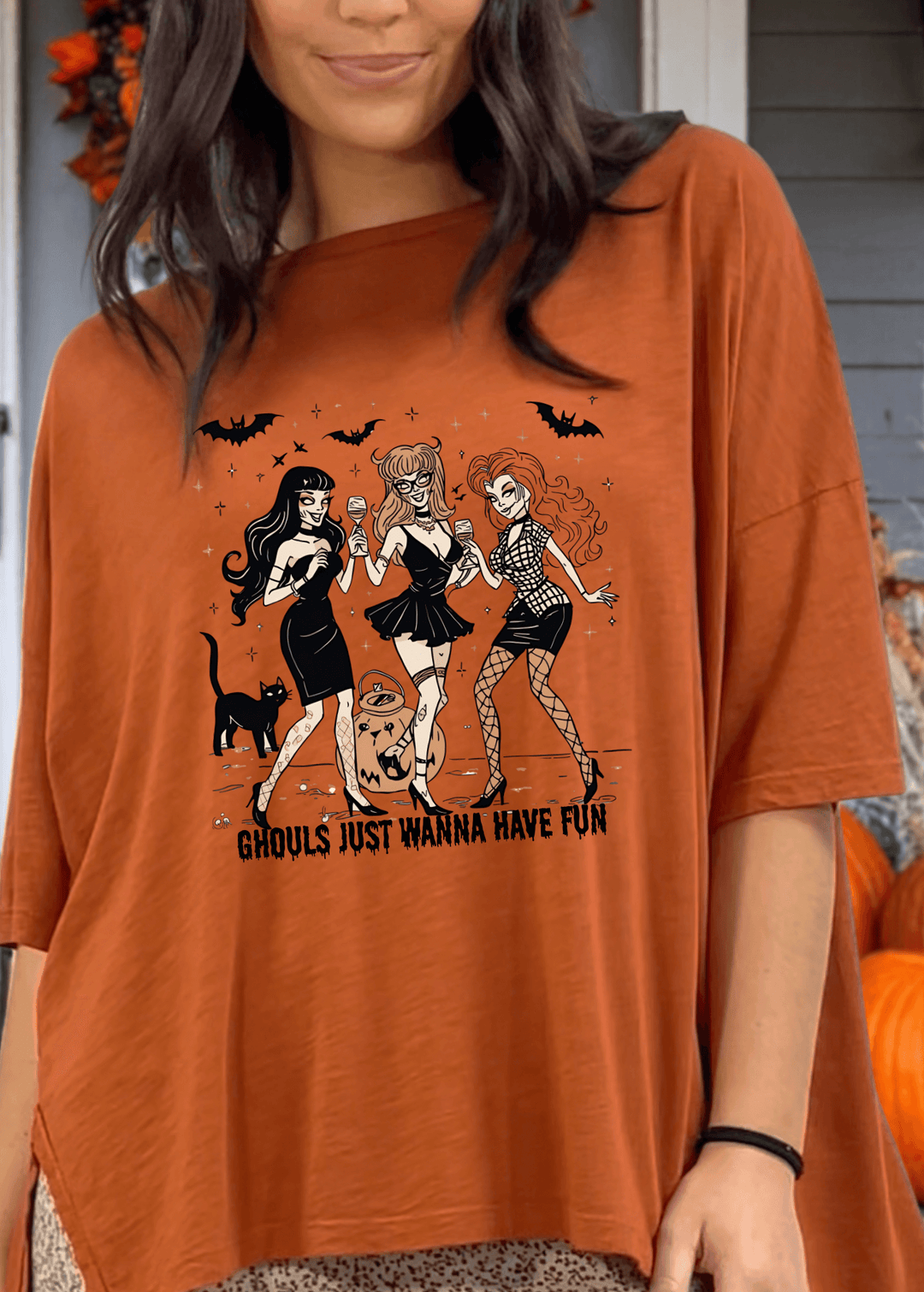 Embrace spooky season in comfort with this Slouchy Oversized Cotton Tee in Gingerbread. Crafted in USA, Playful "Ghouls Just Wanna Have Fun" graphic adds festive charm