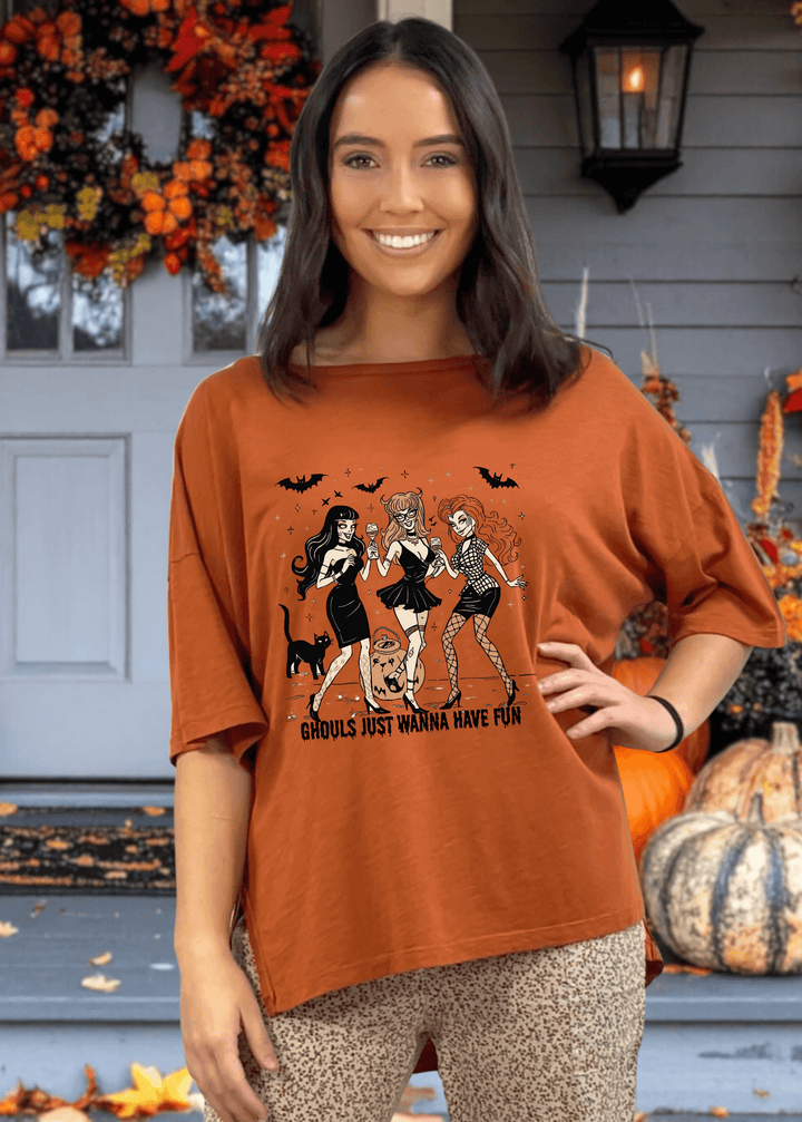 Embrace spooky season in comfort with this Slouchy Oversized Cotton Tee in Gingerbread. Crafted in USA, Playful "Ghouls Just Wanna Have Fun" graphic adds festive charm