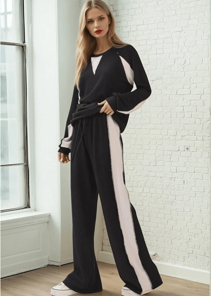 Experience effortless style and comfort with the Hailey Rib Knit Color Block Pullover (Style TL2053) with matching lounge pant (PA1145). Crafted in the USA from a soft, stretchy fabric, Black with Cream contrast