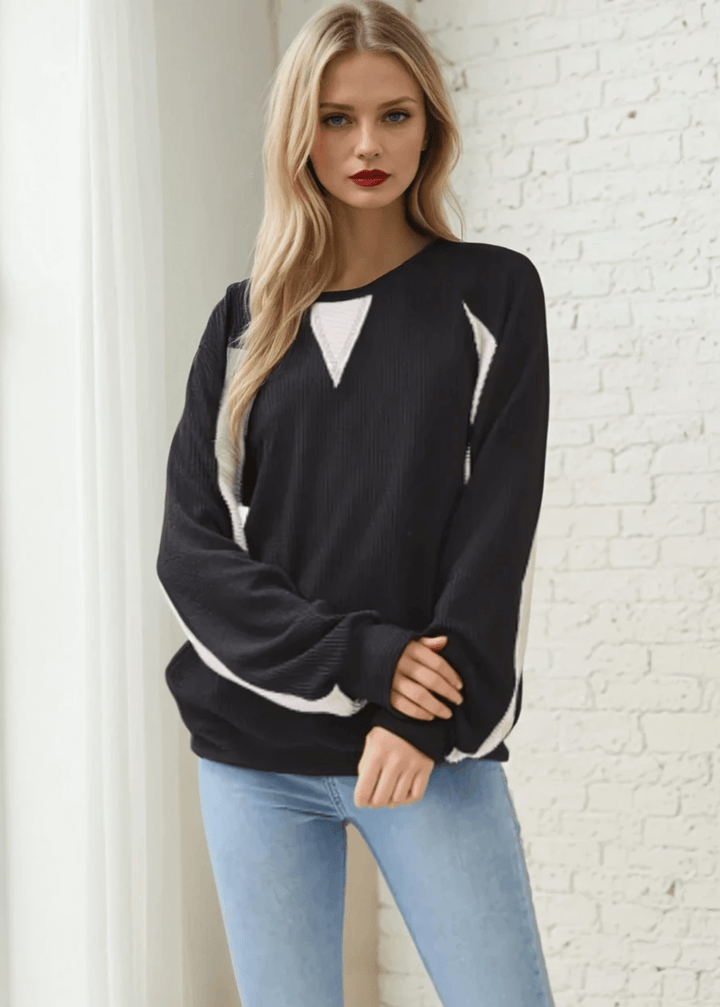 Experience effortless style and comfort with the Hailey Rib Knit Color Block Pullover. Crafted in the USA from a soft, stretchy fabric, Black with Cream contrast