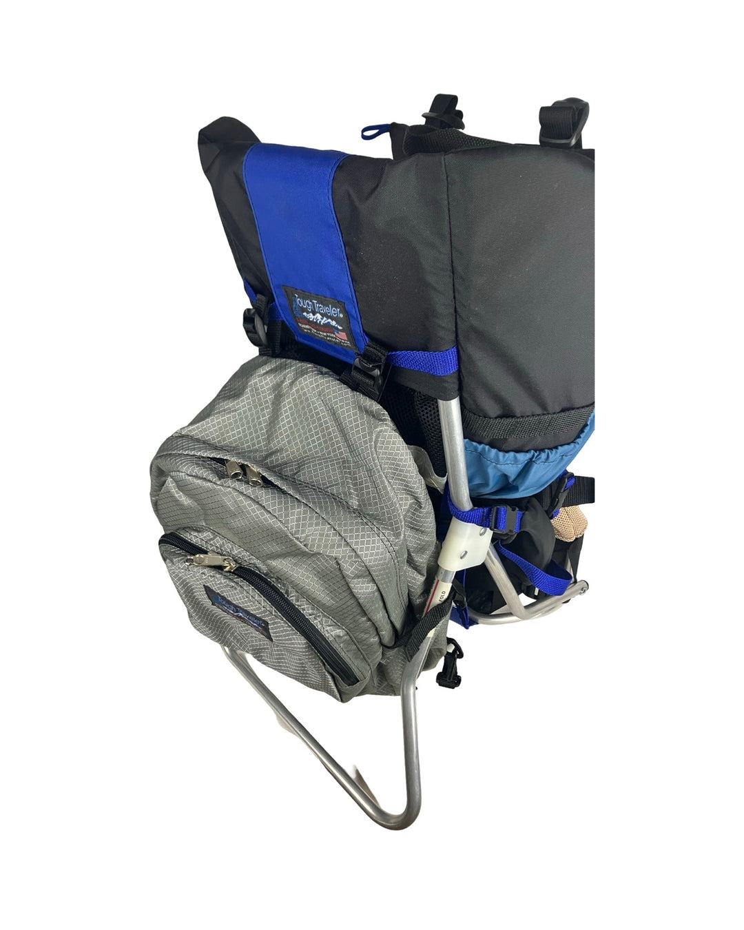 Made in USA, silver diamond diaper bag backpack hanging on a blue and black child carrier