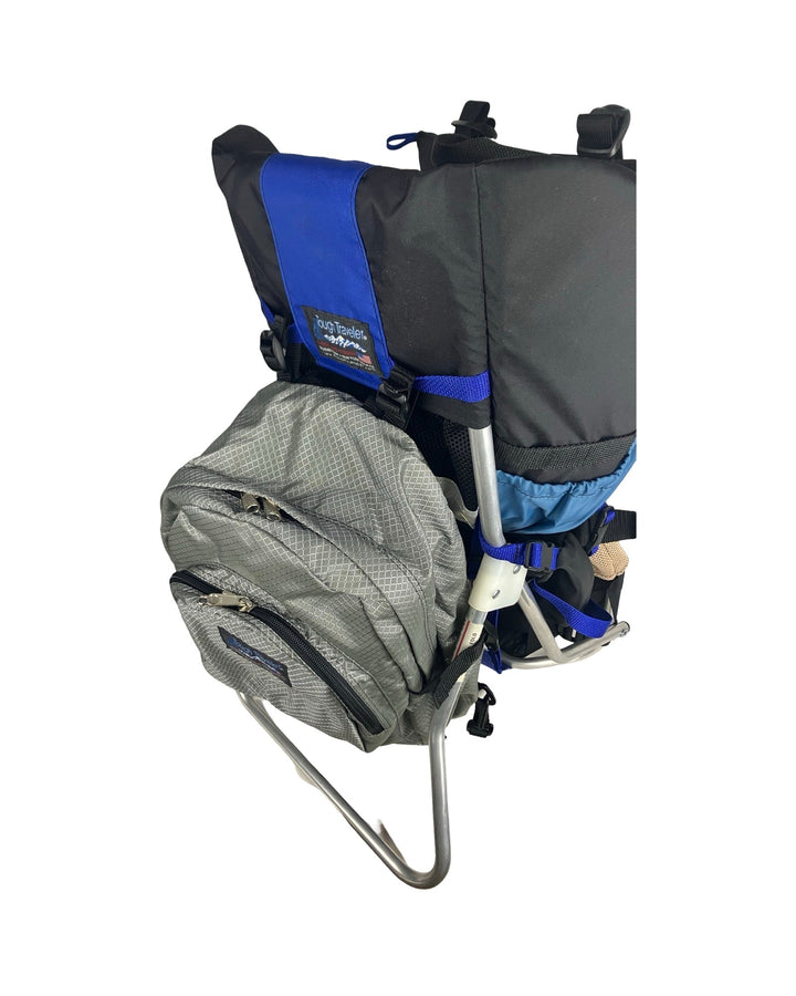 Made in USA, silver diamond diaper bag backpack hanging on a blue and black child carrier