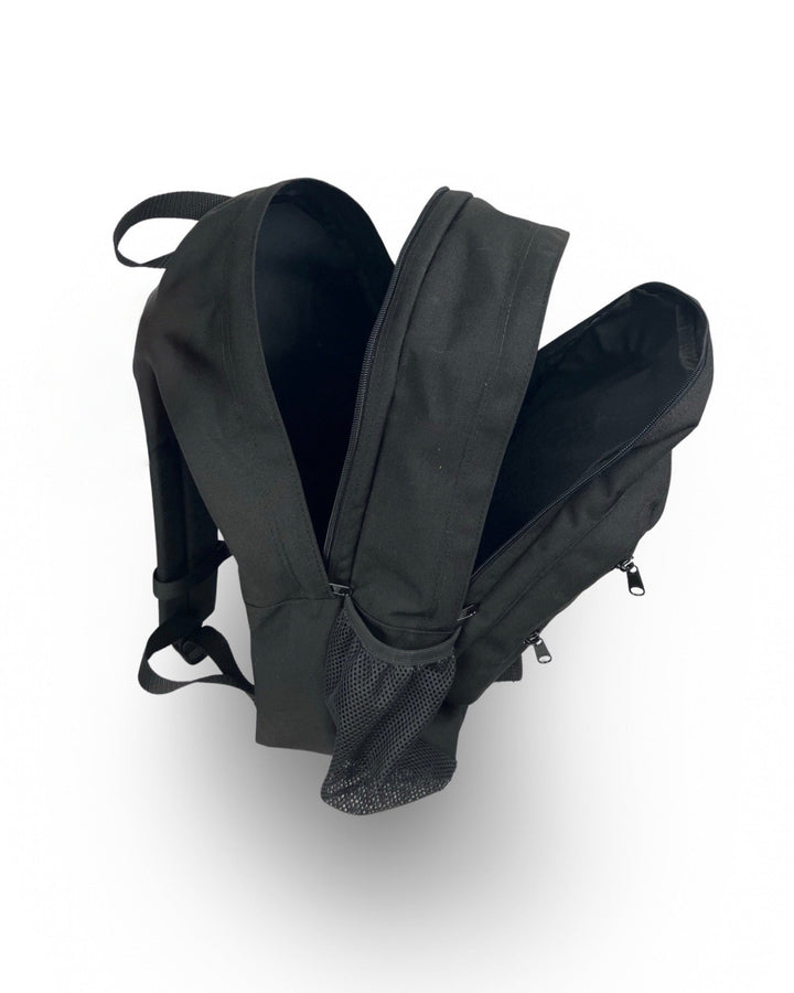 Made in USA, open black backpack showing two main compartments