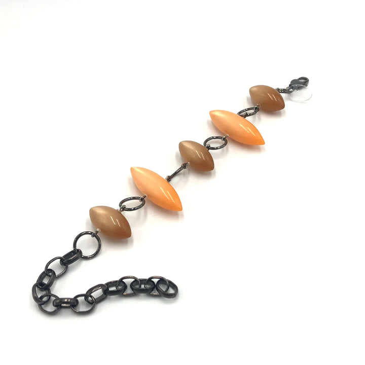 Moonglow pod station bracelet in tangerine &amp; champagne. Vintage 1960s Lucite, adjustable 6.5"-10", hypoallergenic. Stackable, made in USA.