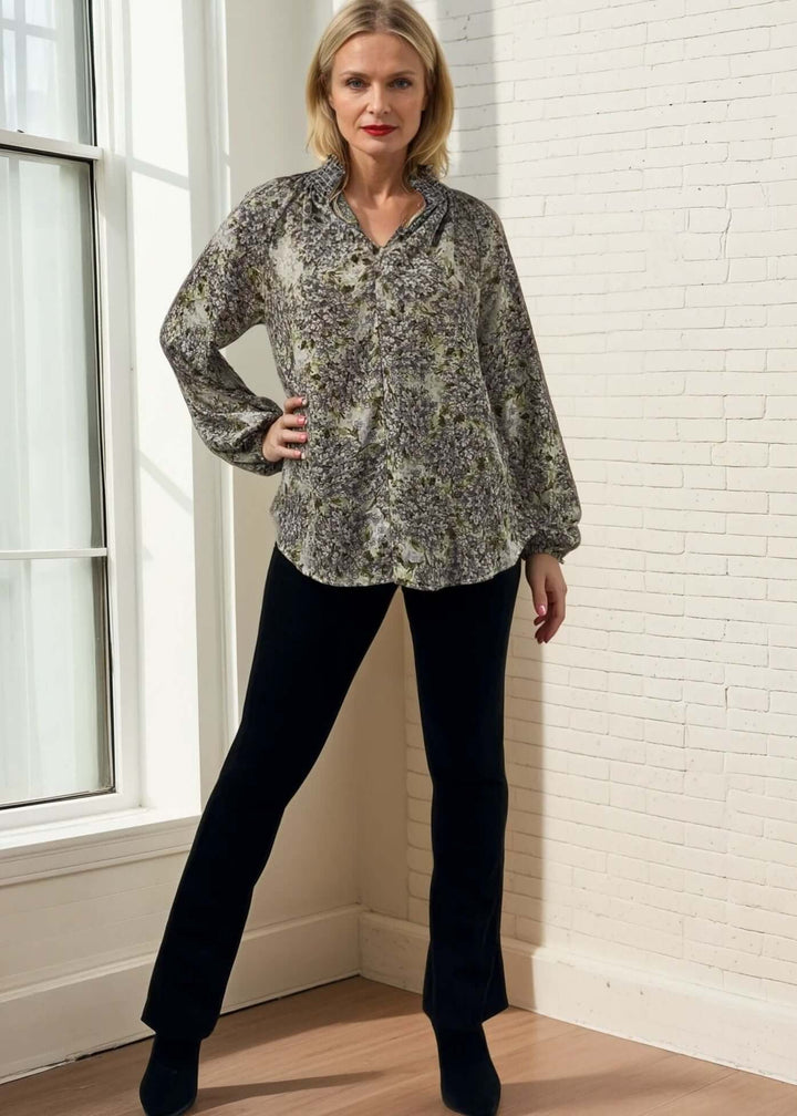 The USA made Ava Mock Stand Collar Blouse features a delicate smocked high collar with a split neckline, adding subtle sophistication to your wardrobe. Designed with long puff sleeves and elasticized cuffs, it offers both comfort and refined style