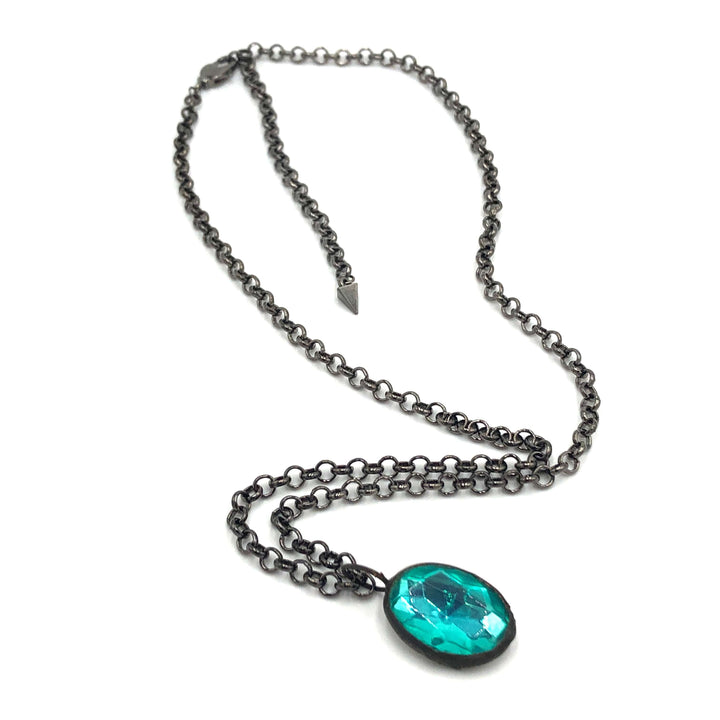 Teal faceted oval pendant, hand-wrought with vintage components on a gun metal chain. 3 lengths available. Limited edition, made in USA.