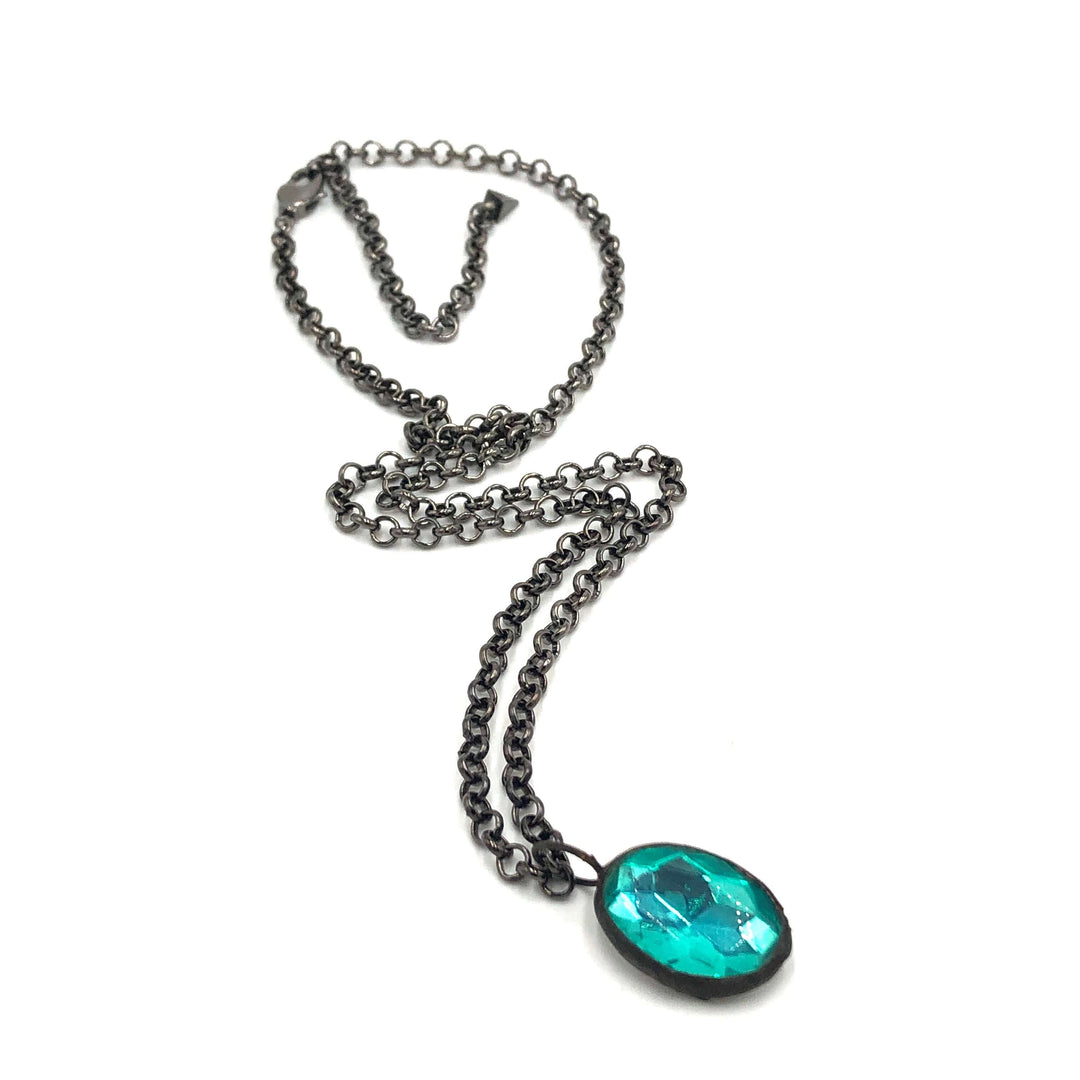 Teal faceted oval pendant, hand-wrought with vintage components on a gun metal chain. 3 lengths available. Limited edition, made in USA.