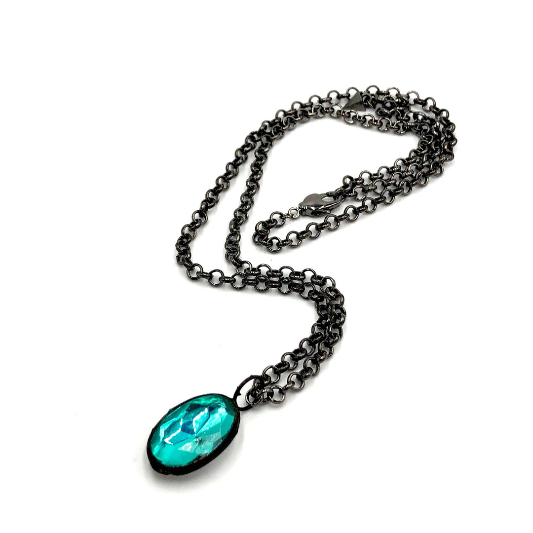 Teal faceted oval pendant, hand-wrought with vintage components on a gun metal chain. 3 lengths available. Limited edition, made in USA.