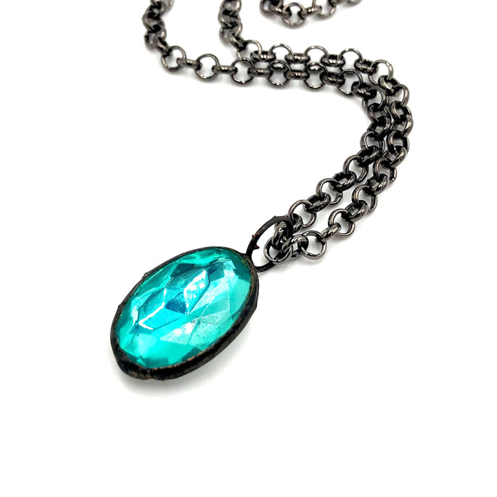 Teal faceted oval pendant, hand-wrought with vintage components on a gun metal chain. 3 lengths available. Limited edition, made in USA.