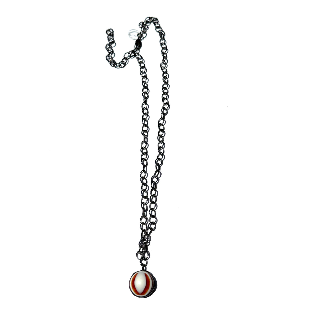 Hand-wrought tortoise bullseye pendant on a 26" hypoallergenic gun metal chain. Limited edition, adjustable, made in USA. Perfect for layering.