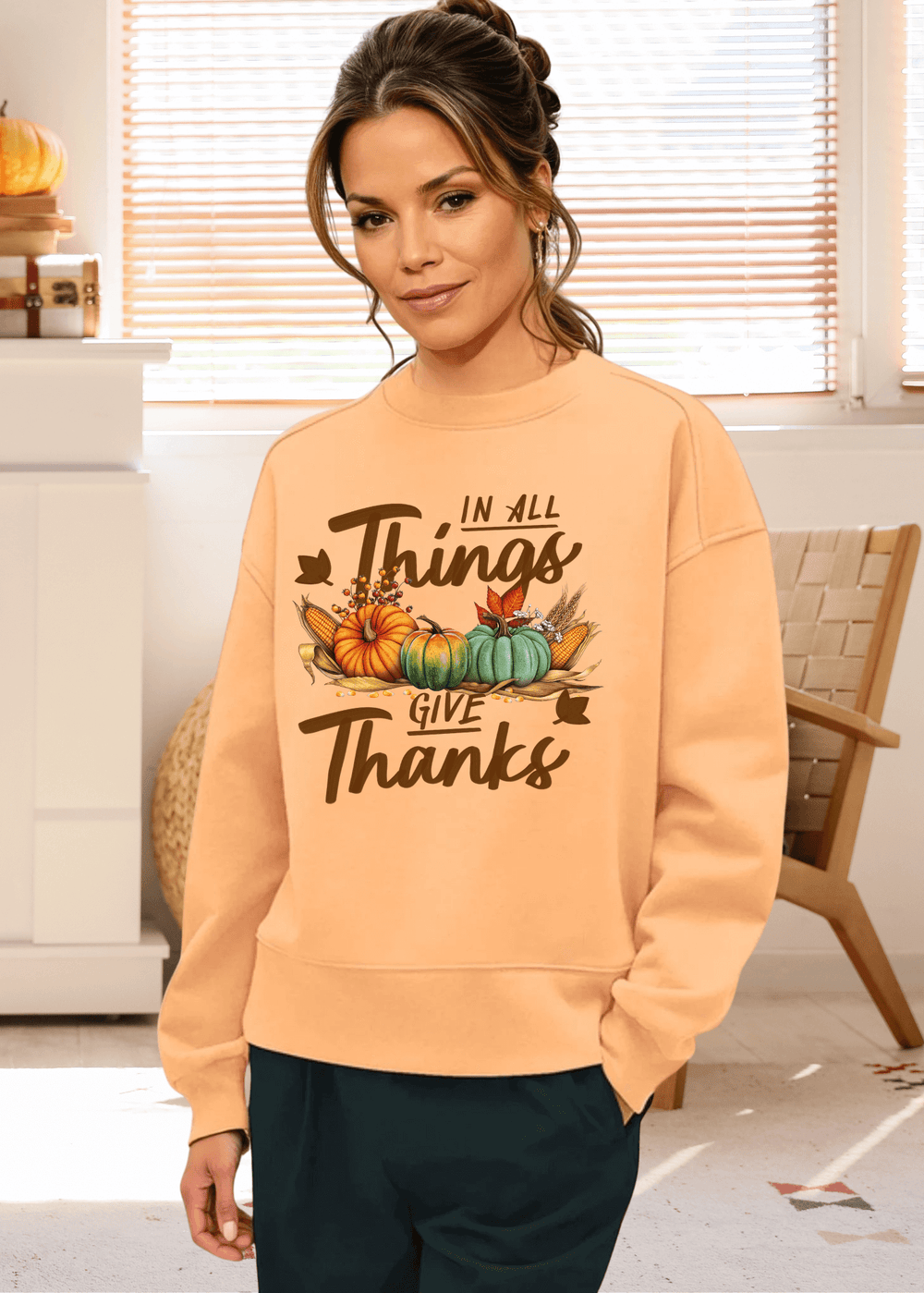 Embrace cozy fall vibes with this heavyweight apricot sweatshirt, featuring the heartfelt "In All Things - Give Thanks" graphic. Made in the USA from soft cotton-polyester blend
