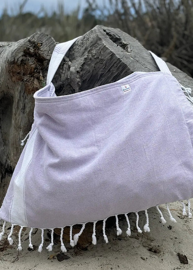 Shop the Beachables Solid 3-in-1 Turkish Cotton Beach Bag – converts from bag to towel to chair cover. Sand-resistant, quick-dry, machine washable. Made in USA.