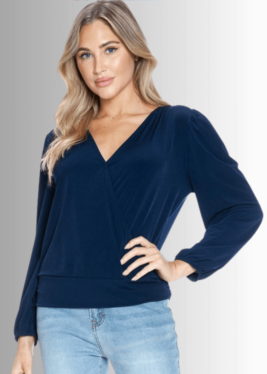 Elevate your wardrobe with the Maxine Surplice Tie Back Top in navy. Crafted in the USA from stretchy jersey fabric, this waist-length, long-sleeve, both comfort and style