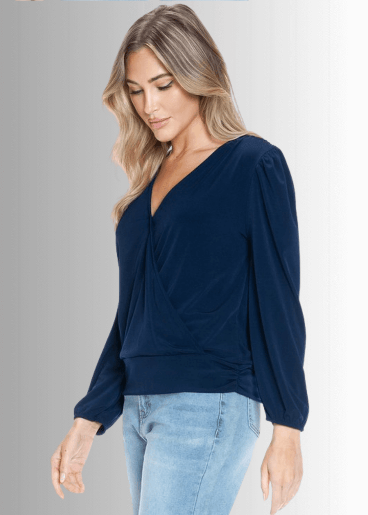 Elevate your wardrobe with the Maxine Surplice Tie Back Top in navy. Crafted in the USA from stretchy jersey fabric, this waist-length, long-sleeve, both comfort and style