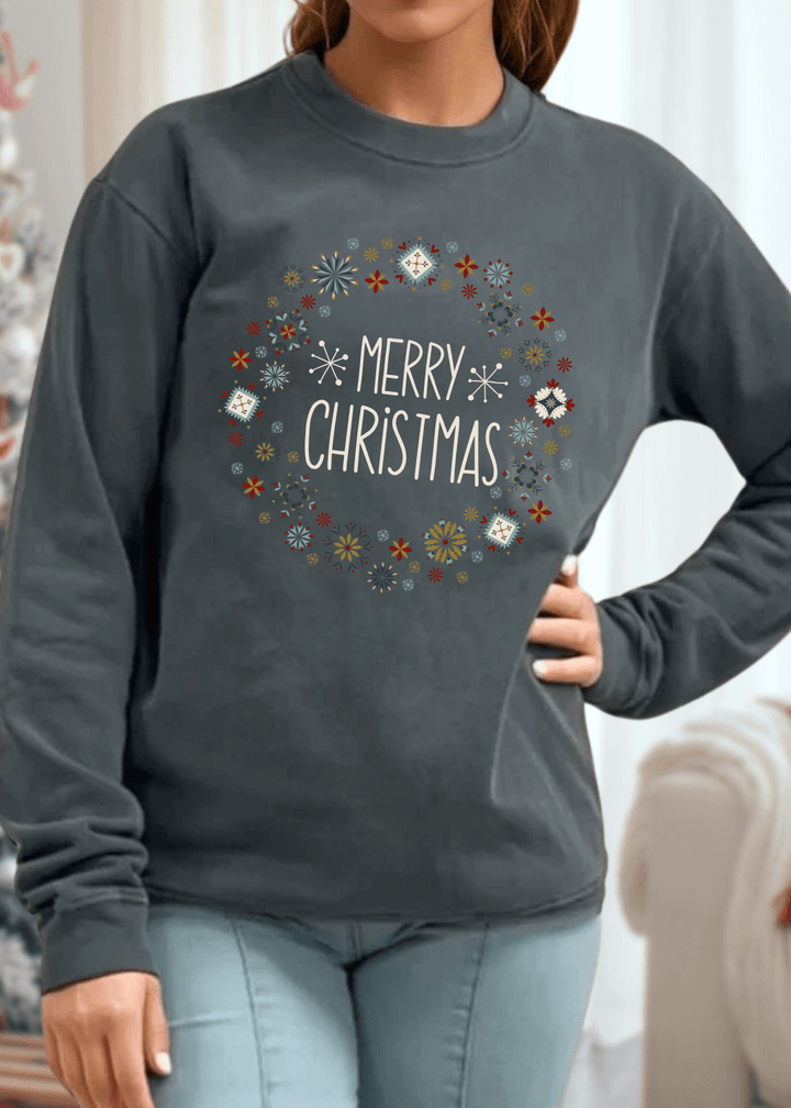 Celebrate the season in comfort with this heavyweight pigment-dyed cotton sweatshirt, featuring a festive "Merry Christmas" wreath graphic in rich evergreen. Crafted from 100% cotton with a relaxed, loose fit and crew neck, it's designed for all-day coziness without compromise. 