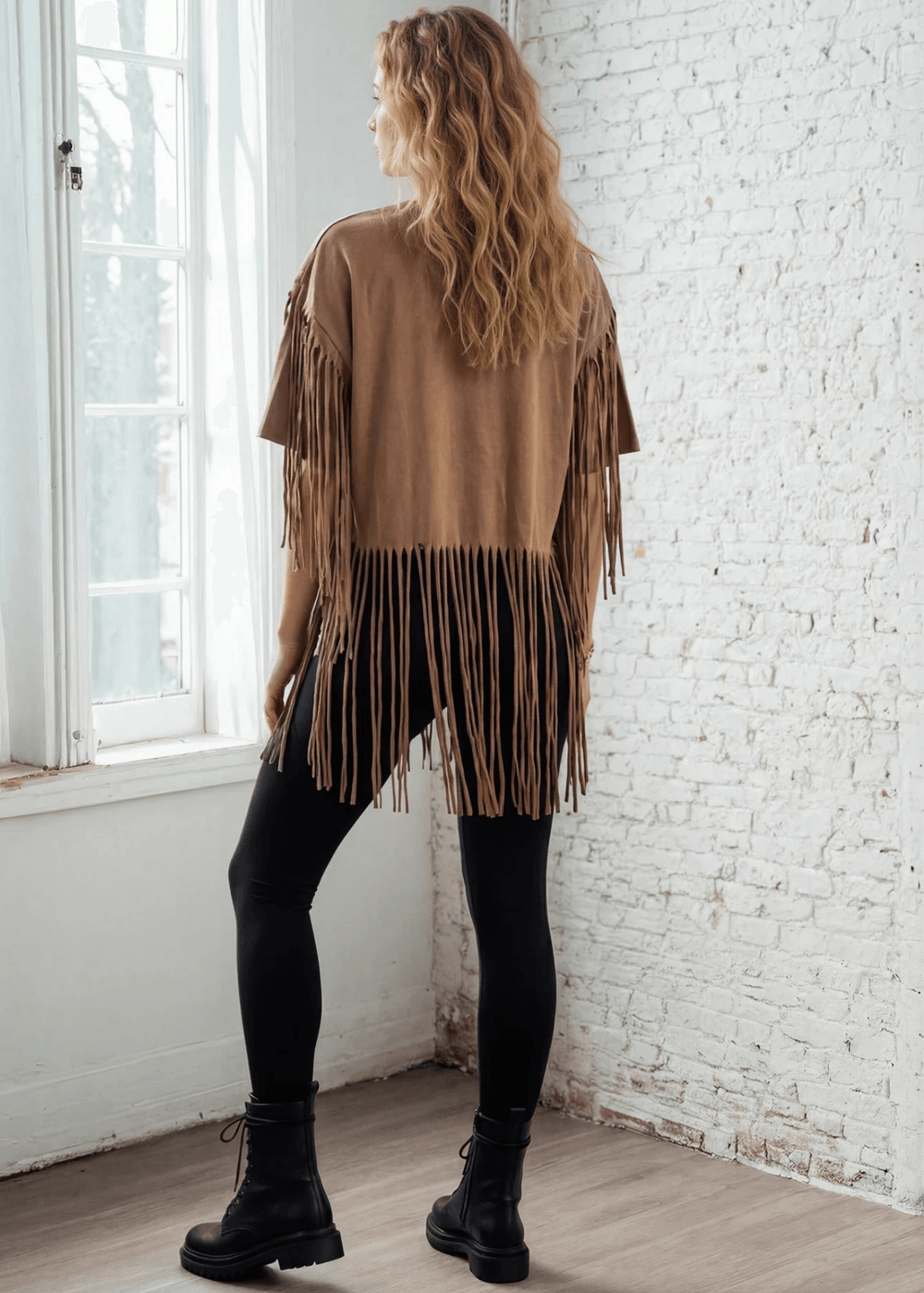 The Farrah Fringe Nashville Top brings effortless style to your everyday wardrobe. Featuring playful fringe detailing and a relaxed silhouette, this versatile piece pairs beautifully with jeans, leggings, or your favorite bottoms. The soft cotton-blend fabric with a touch of spandex offers comfort and gentle stretch, while the round neckline and short sleeves keep things casual and chic. Perfect for layering or wearing solo, this made-in-USA top is a wardrobe essential that works from season to season. 