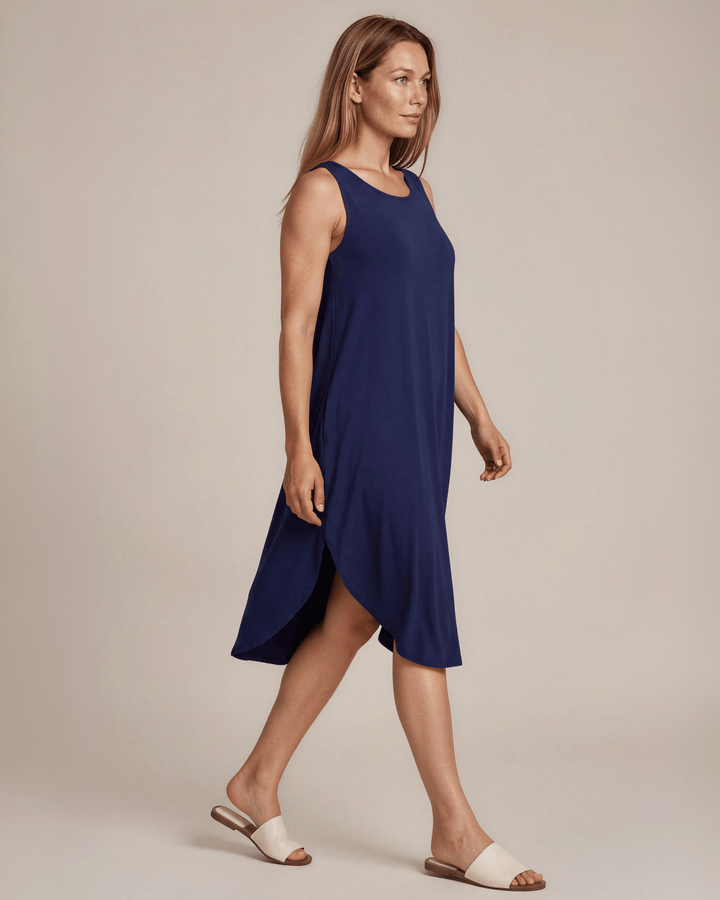 Sammie Sleeveless Midi Dress in navy blue. Relaxed fit, scoop neck, side pockets &amp; slits. 95% Rayon, 5% Spandex. Made in USA.