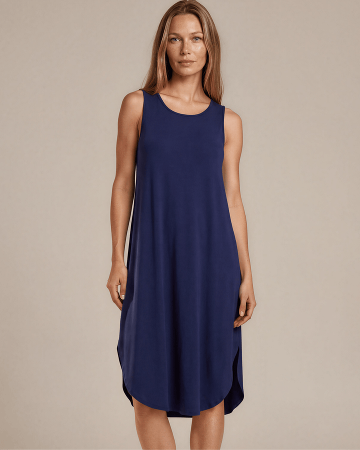 Sammie Sleeveless Midi Dress in navy blue. Relaxed fit, scoop neck, side pockets &amp; slits. 95% Rayon, 5% Spandex. Made in USA.