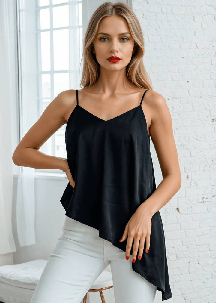 Embrace effortless edge with this sleek black satin tank. Adjustable shoulder-to-back ties let you customize the fit while the open back and lace-up detail deliver undeniable allure. A ruffled, asymmetrical hem adds movement and intrigue to every wear.