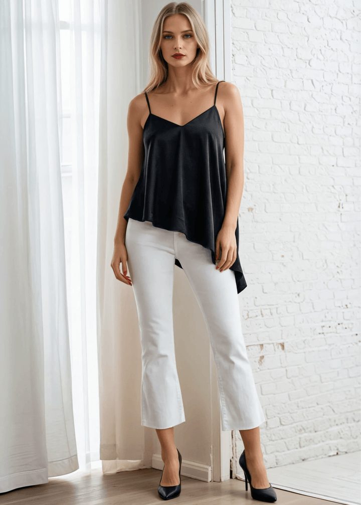 Embrace effortless edge with this sleek black satin tank. Adjustable shoulder-to-back ties let you customize the fit while the open back and lace-up detail deliver undeniable allure. A ruffled, asymmetrical hem adds movement and intrigue to every wear.